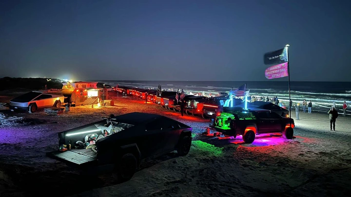 Tesla Cybertrucks gathered at Boca Chica Beach on Saturday for a spectacular light display.&nbsp;