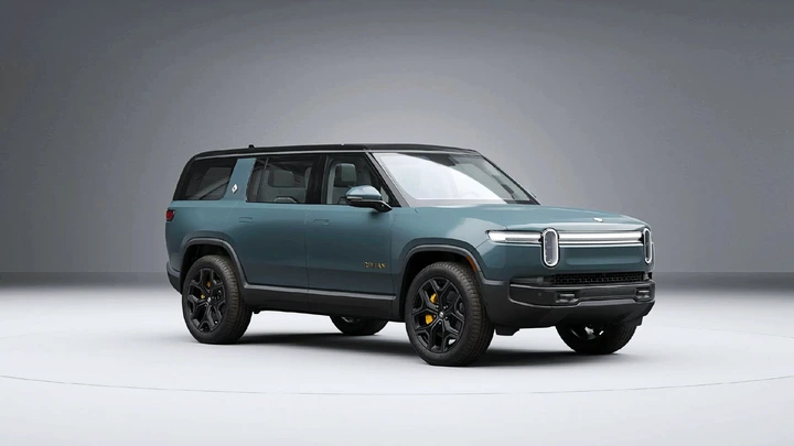 A blue 2025 Rivian R1S midsize electric SUV. 