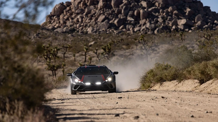 An action front shot of a Lamborghini Huracán Sterrato driving off-road.