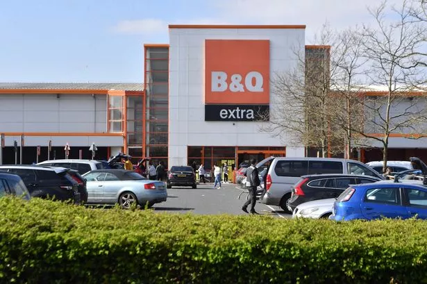 B&Q parent firm's CEO sees pay slashed by almost £4m amid profit hit